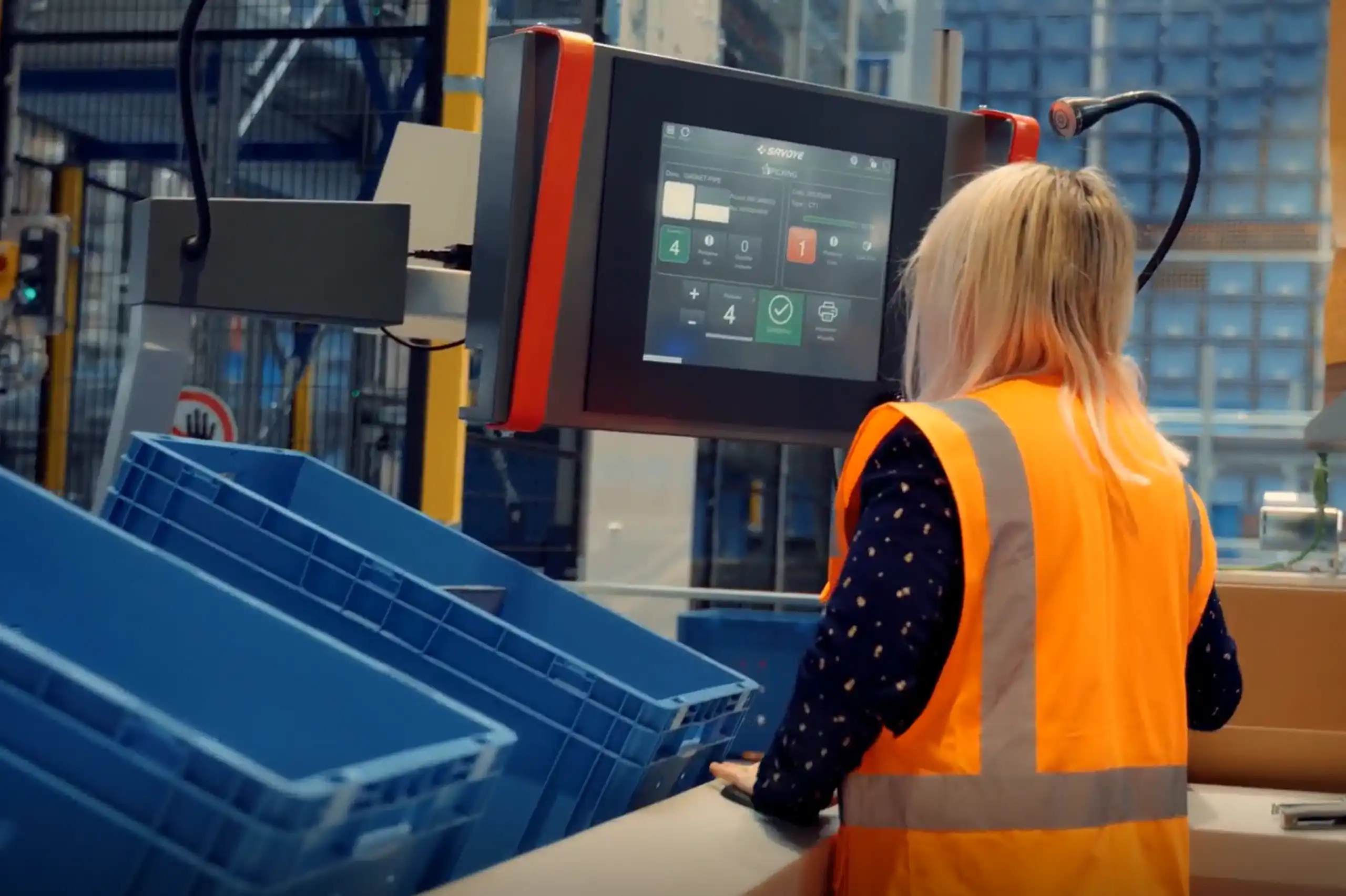 A woman at a GTP pick station SAVOYE